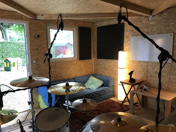 Seen from the position of the drummer (notice the whiteboard looking infrared heater on the wall)