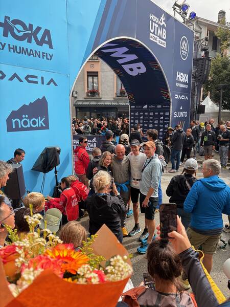 And there he is, after having just won the race (black cap and white shirt)